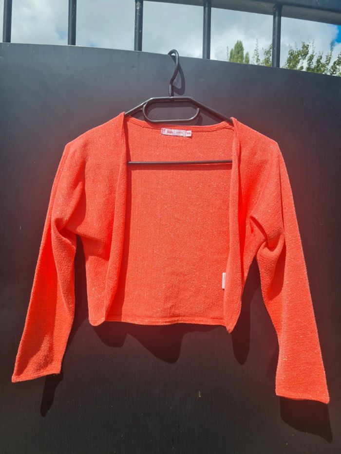 Boléro corail à paillettes Gémo taille 10 ans