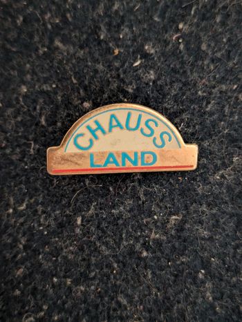 Pins publicitaire Chauss Land