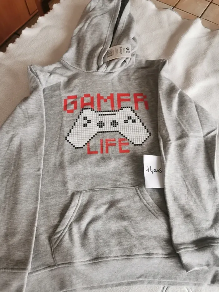 Pull neuf 14 ans
