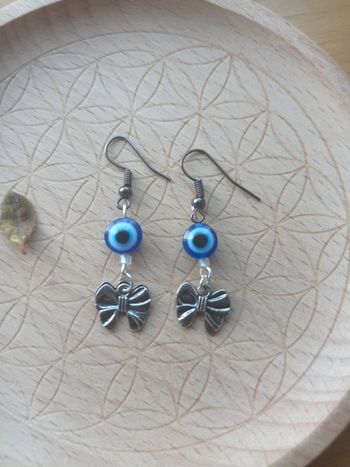 Boucles d'oreilles oeil grec et noeuds