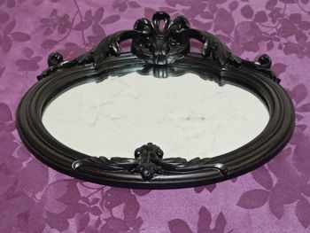 Miroir oval noir