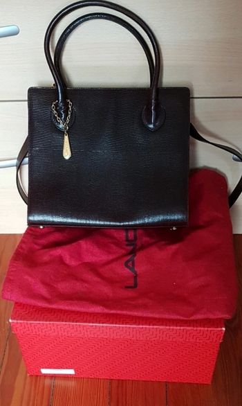 Sac lancel vintage porté main ou épaule