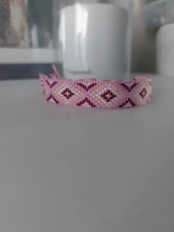 Magnifique bracelet tissé rose