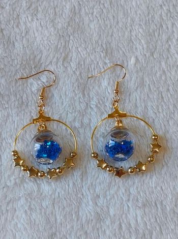 Boucles d'oreilles creoles dorées étoiles