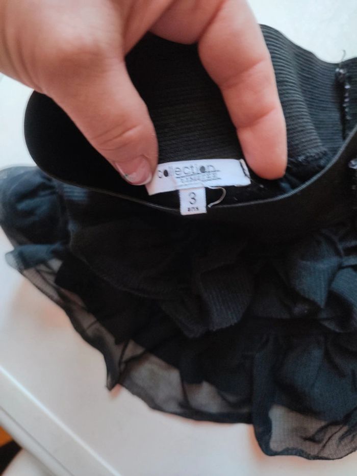 Petite jupe noire avec nœud à paillettes - photo numéro 4