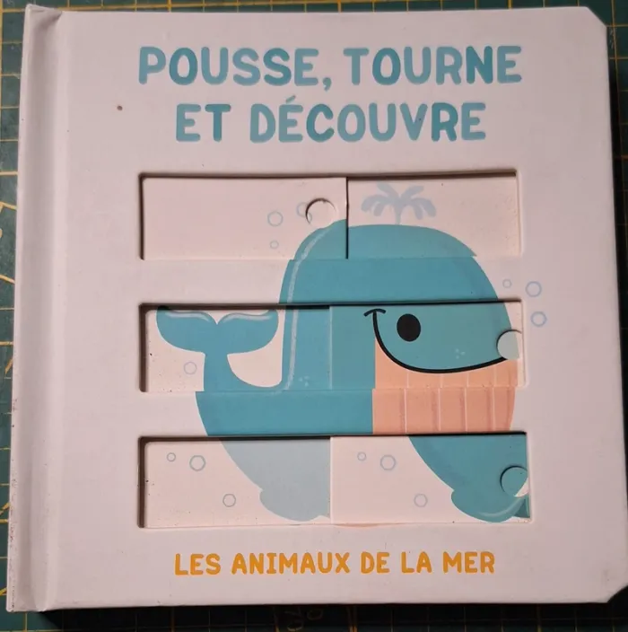 Livre "pousse, tourne et découvre " neuf