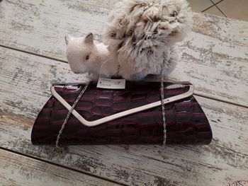 Pochette à main parme neuf