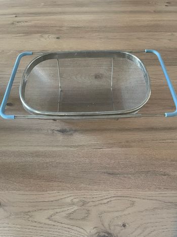 Passoire extensible inoxydable neuve caoutchouc bleu