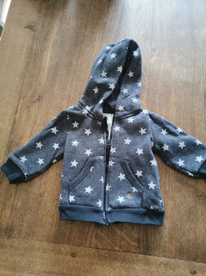 Gilet avec capuche zippé