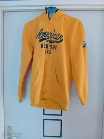 Veste jaune  taille 14 ans
