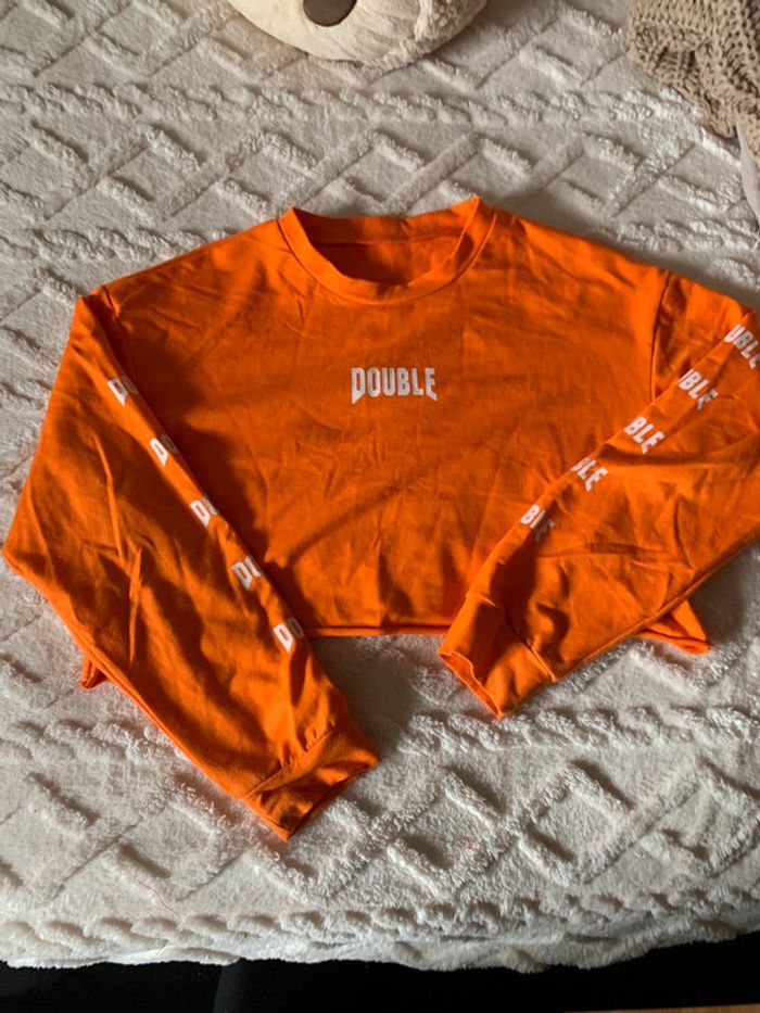 Pull court taille M
