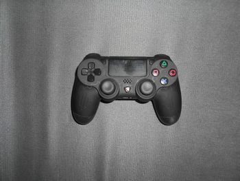 Manette de jeu sans fil (Echtpower) pour PS4 (+ cable de charge)