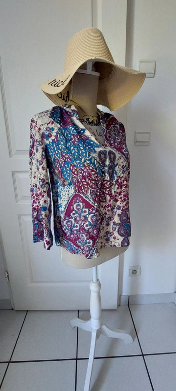 Superbe blouse La fee
marabouts taille S (36-38)