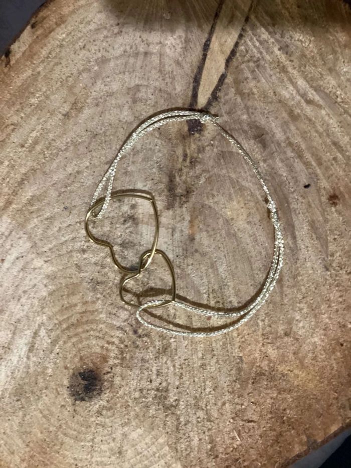 Bracelet 2 cœurs fins acier inoxydable or entrelacés cordon doré pailleté - photo numéro 2