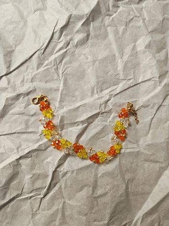 Bracelet fait main orange jaune blanc doré