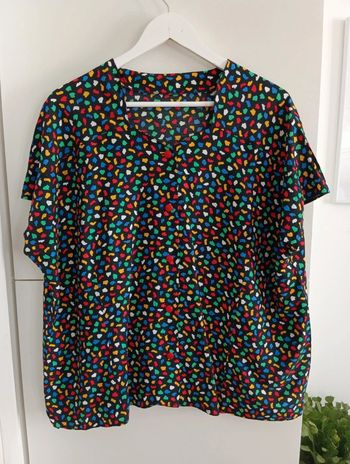 Blouse vintage noire boutonnée à pois multicolores