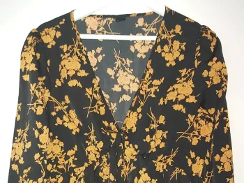 Neuf- top péplum noir/ocre