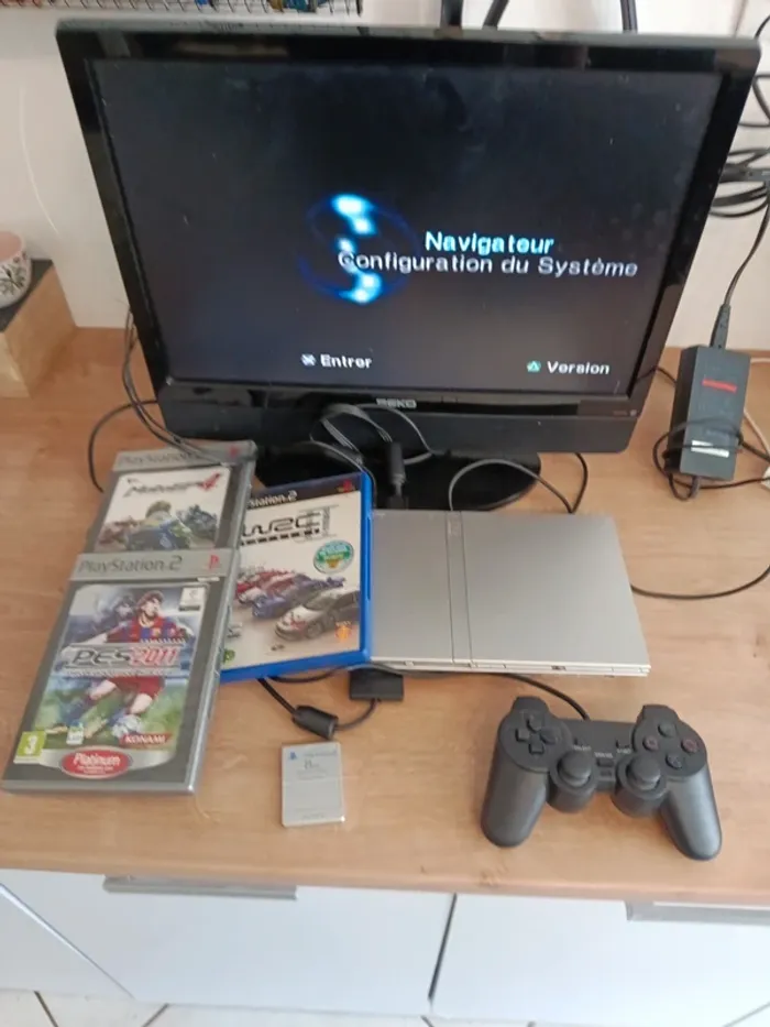 PlayStation 2 silver avec 3 jeux manette carte mémoire