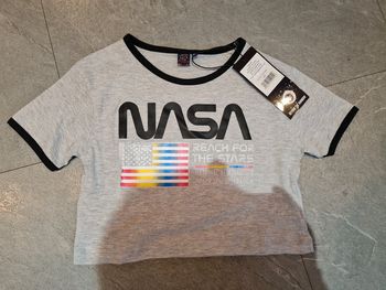 Tee shirt court noté taille 14 ans mais taille petit