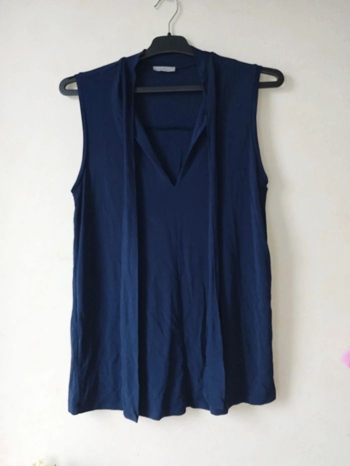 Blouse élégante sans manches