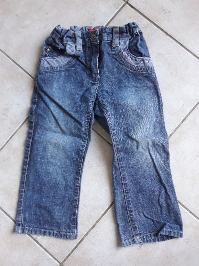 Jean avec strass et motif poche arrière
