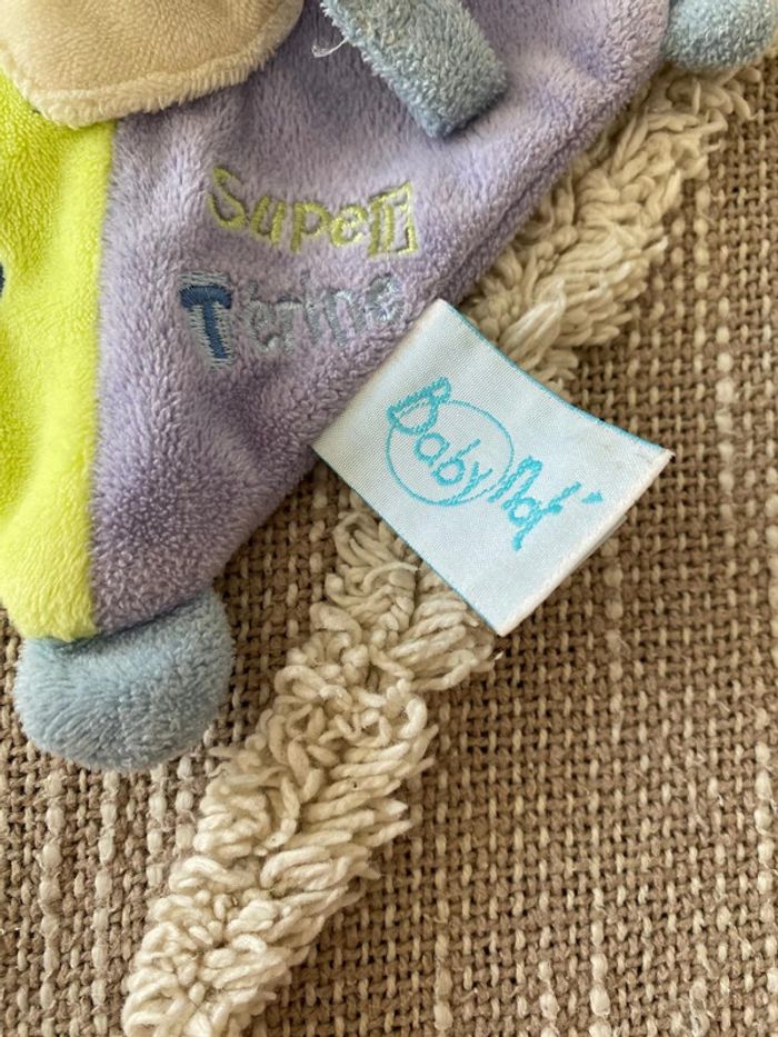 Peluche doudou plat accroche tétine 19cm Baby Nat ours violet vert et beige très bon état - photo numéro 4