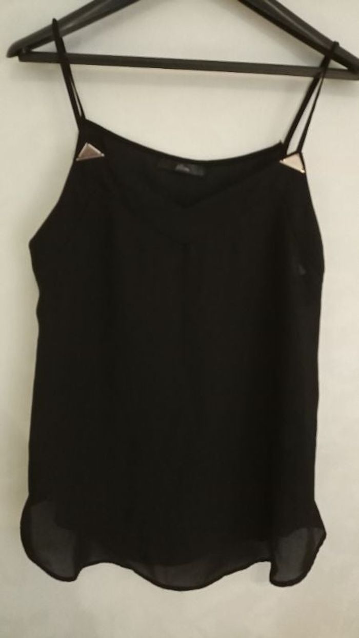 Haut a bretelles. Noir taille 38.