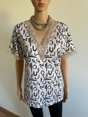 Blouse beige et noire à manches courtes taille XL jamais portée