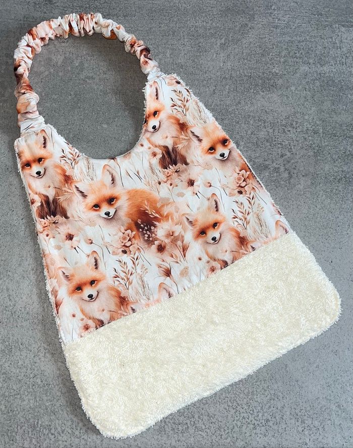 Bavoir élastique renard 6/24 mois