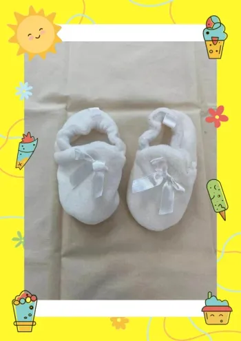 Chaussons blancs noeud 9 12 mois
