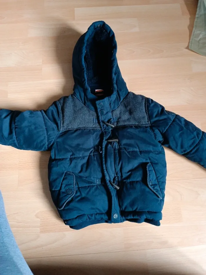 Manteau tape à l'oeil