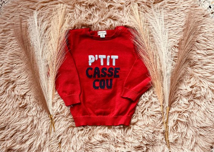 Pull rouge p’tit casse cou