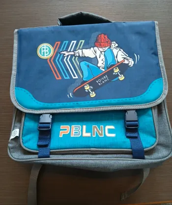 Cartable garçon poivre blanc skate