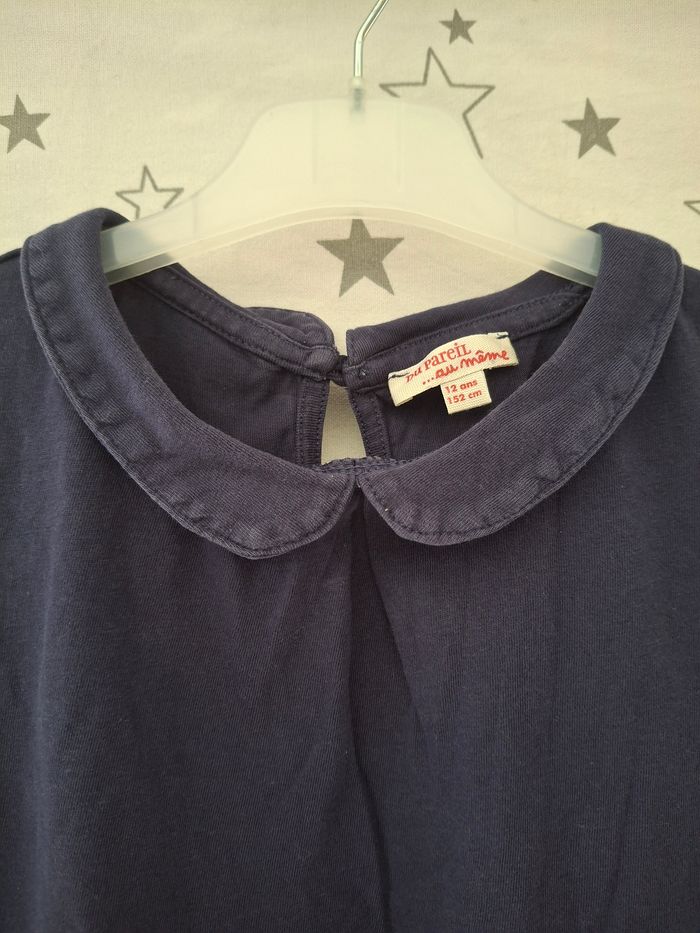 Tee-shirt bleu marine avec col rond 12 ans DPAM
Petit bouton derrière
Très bon état ni trous ni tache - photo numéro 3