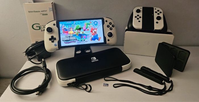 Nintendo switch Oled très bon état + carte sd 256go + accessoires supplémentaires