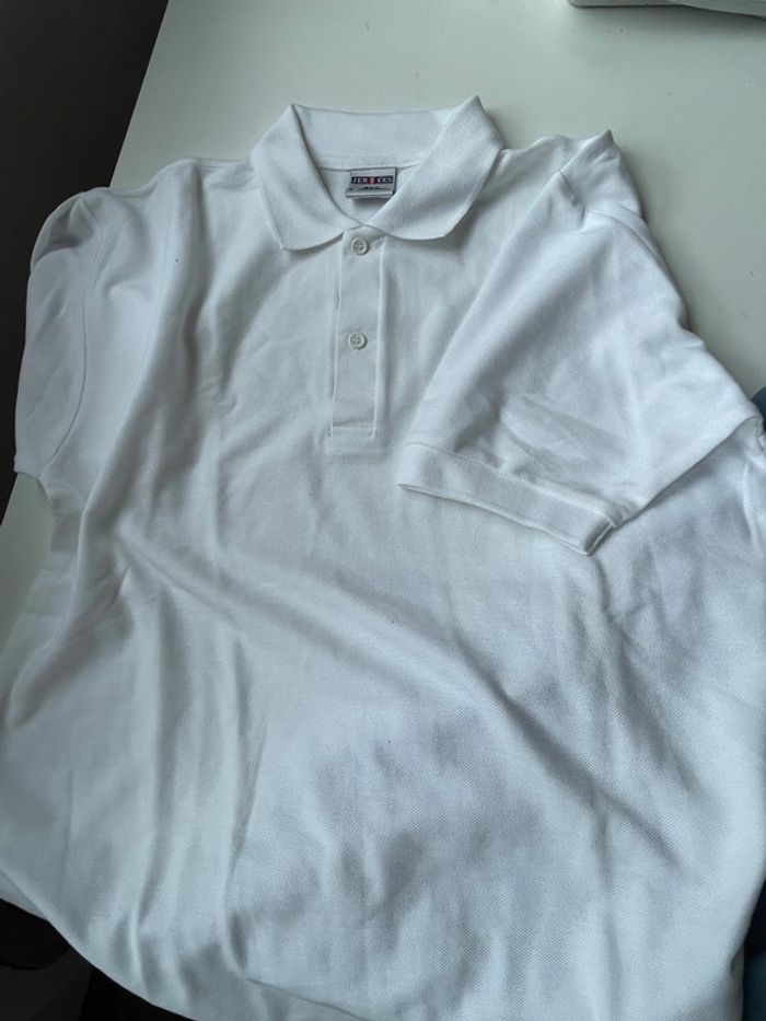 2 polos neuf bleu et blanc taille S/M jerzees - photo numéro 5