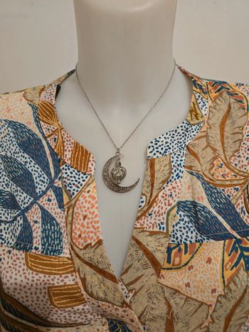 Magnifique collier neuf en acier inoxydable phosphorescent