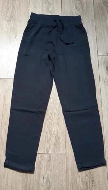 Pantalon fluide gémo noir 10 ans en parfait état