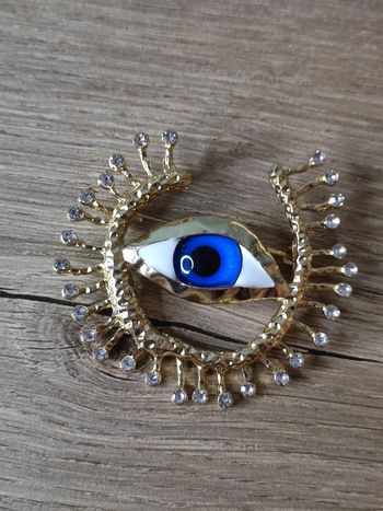 Broche oeil acier rétro