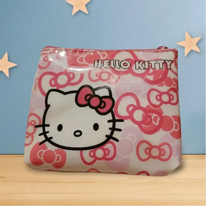 Très jolie porte monnaie hello Kitty 🩷 avec bague et boucles d'oreilles
