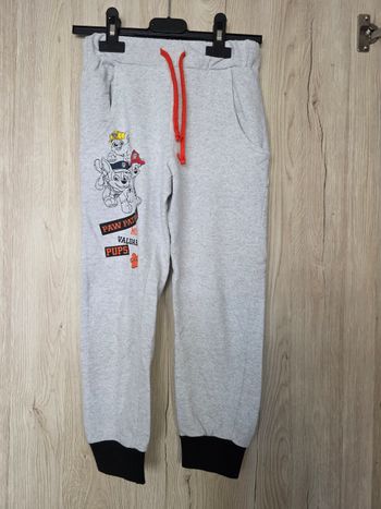 BAS DE JOGGING GARÇON PAW PATROL AVEC UN CORDON POUR SERRER ET POCHES SUR LES CÔTÉS TAILLE 6ANS MARQUE NICKELEDEON