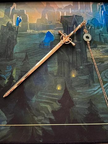 Baton à chignon épée dorée