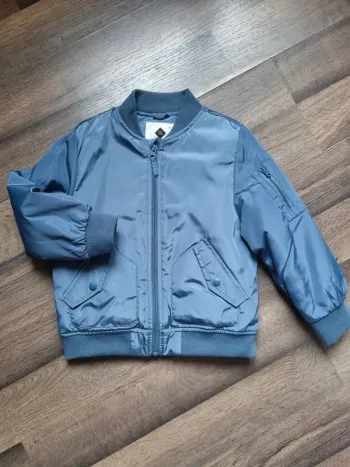 Veste / Manteau zippé doublé bleu métallisé. Garçon. Taille 4 / 5 ans. Tex. TBE