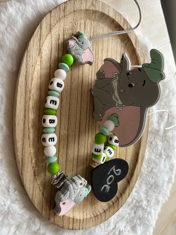 Attache tétine et anneaux de dentition