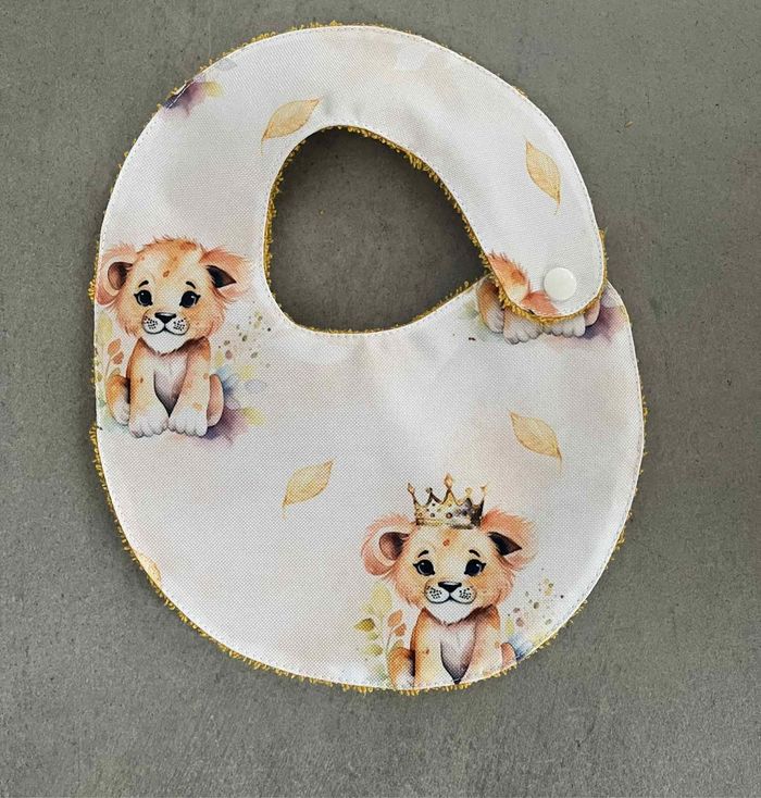Bavoir imperméable 0/6 mois lionceau