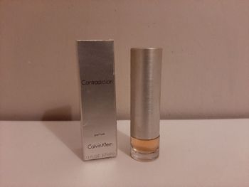 Miniature de parfum.  Contradiction.  C.k