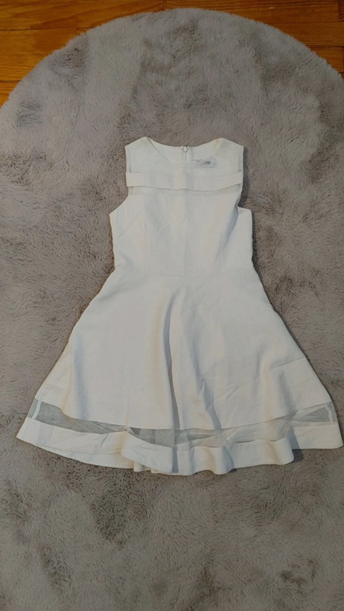 Sans manche couleur blanc cassé marque incity taille 8 ans