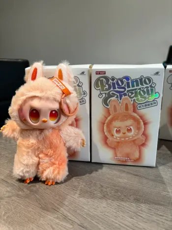 Labubu big into energy orange