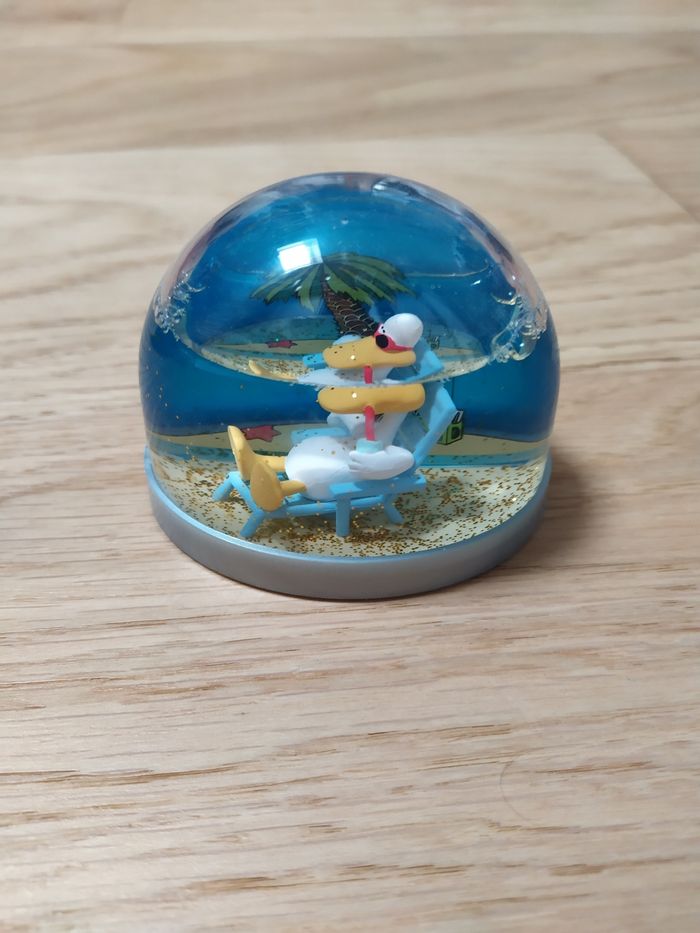 Boule à neige démon et merveilles Sitting Duck