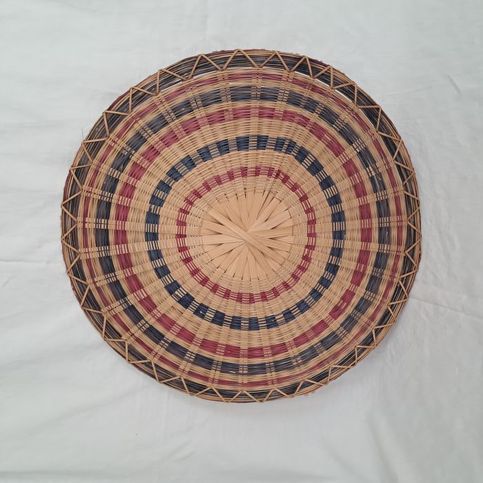 Décoration ronde murale en rotin osier multicolores du Laos